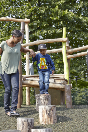 Mum and boy playing in park