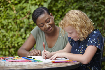 Mum and girl colouring