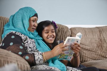 mum and girl reading together
