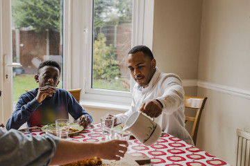 Dad with son eating at the table