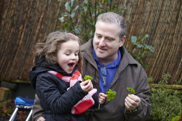 Dad with daughter in garden
