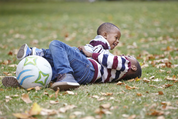 Siblings playing in park
