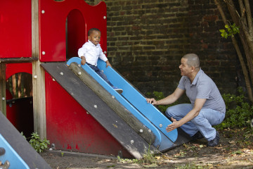 Dad and son on slide