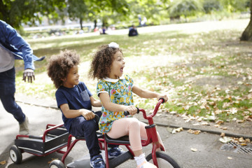 Siblings on bike