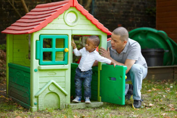 Dad and son in playhouse