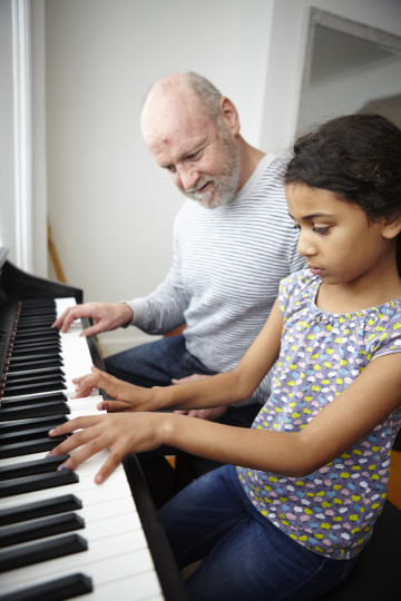 Dad and daughter at piano practice
