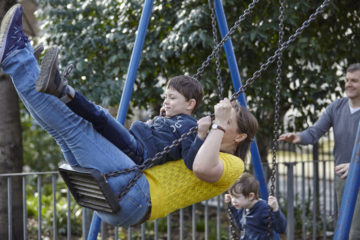 Mum on swing with son